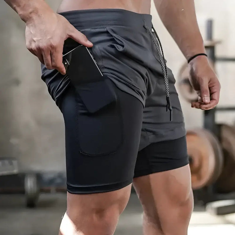 Shorts esportivos com camada de compressão embutida e bolso com zíper.